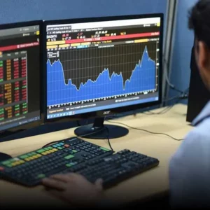 A Carsons employee working beside a computer